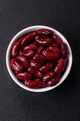 Canned red beans with salt and spices in a white bowl