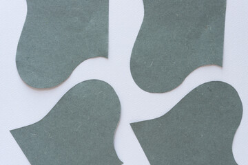 elegant cut paper shapes with wave and curve edges on blank paper