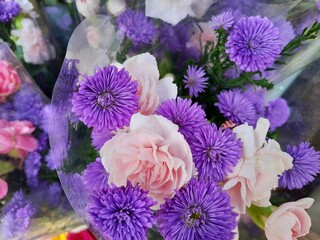 Bouquet of beautiful Purple Callistephus chinensis aka China aster or annual aster and Pink Peony flower for wedding backdrop. Floral Arrangement concept.