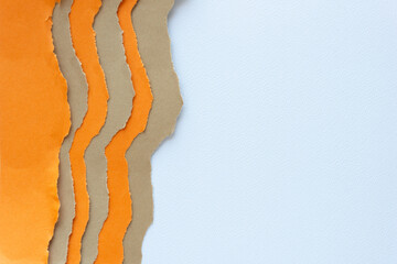 background with blank space and alternating orange and brown paper with torn edges