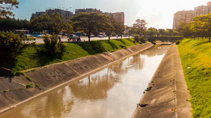 Water canal in a street in Bogotá – Colombia at noon