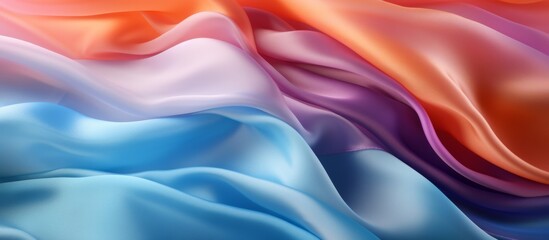 Fototapeta premium A close up of liquidlike, rainbow colored satin fabric resembling water droplets on petals. The vibrant hues of purple, violet, and electric blue create an artful and silky smokelike gesture