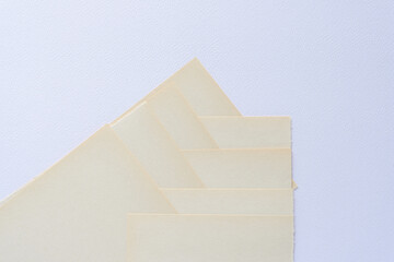 discolored white construction paper sheets