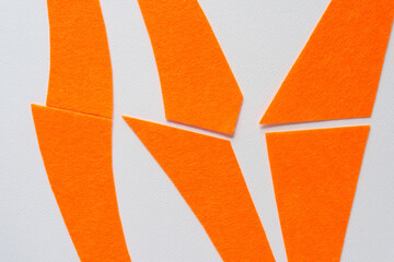 background with abstract orange felt stripes and pieces
