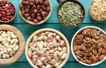 different types of nuts in bowls on the table