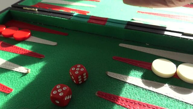 Dice are thrown on a backgammon board