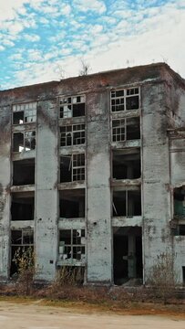 Aerial view of an abandoned industrial plant. Factory ruins. Vertical video