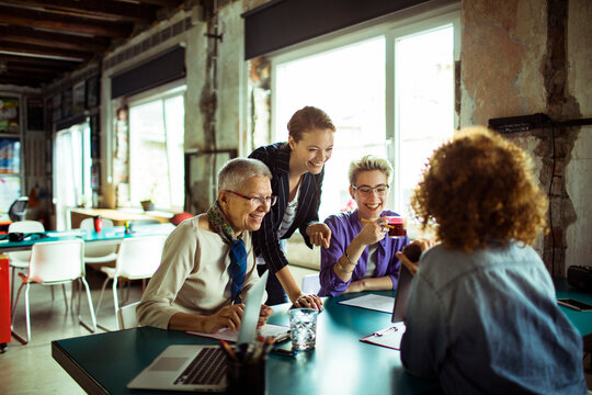 Diverse team of women in a meeting at startup office space
