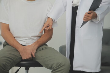 Male diseases. Man presses hands to his groin and suffering from pain, panorama, cropped, studio shot