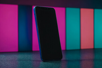 Modern Technology Showcase. Blank Screen Mobile Phone for Graphic Display Montage, Presenting Apps, Websites, or Custom Graphics. Neon Colored background
