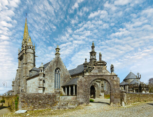 The parish of Guimiliau dedicated to St. Milio and dating 16-17 century. Brittany, France. Spring view.