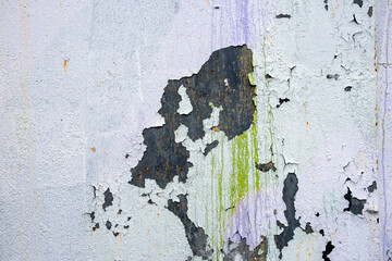 Old weathered wall with peeling paint