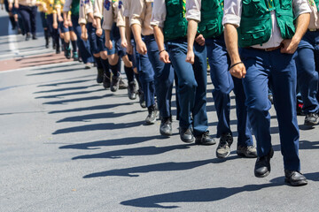 Scout group in uniform marching on parade in Limassol, Cyprus