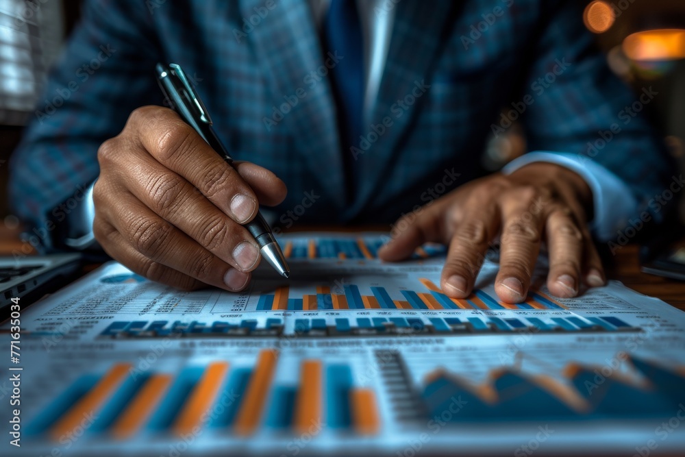 Poster an executive going through bar charts and data analytics with a focus on detail using a metallic pen