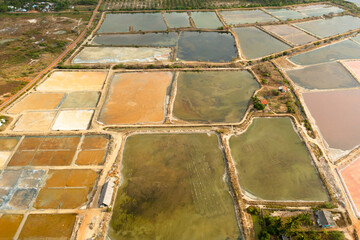 Aerial drone of Salt production facilities saline evaporation pond fields in the salty lake. Sri Lanka
