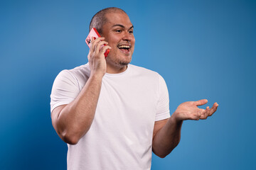man talking on cell phone excited