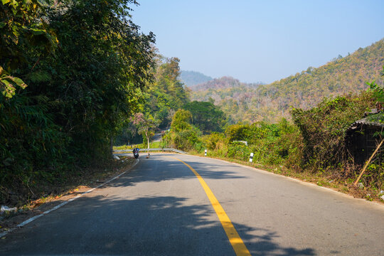 Road winding through the Pai River Valley leading to the Huay Pu Keng long-neck Kayan village in the Mae Hong Son province in the northwest of Thailand, close to the Burma border