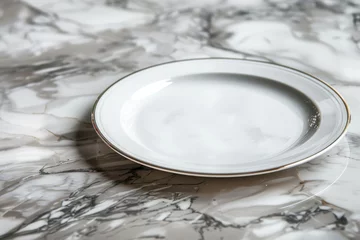 Foto auf Acrylglas Side angle view of a white plate resting on a marbled counter © Ilia Nesolenyi