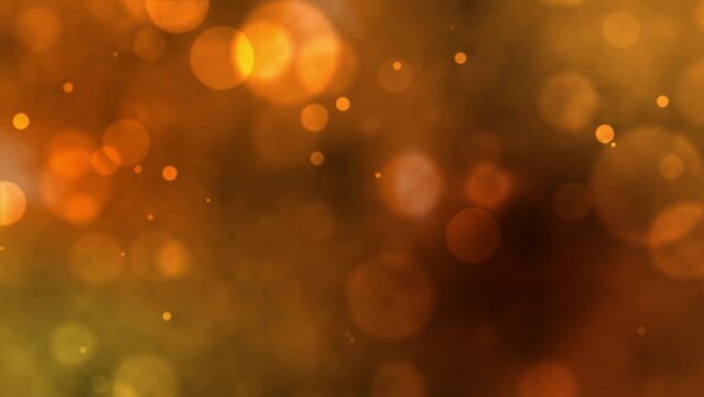 Blurred light particles come and go on dark orange smoke background. Seamless loop animation.