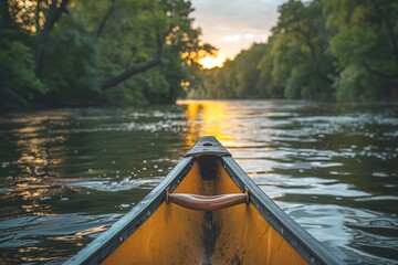 A calm river journey captured from the canoe's bow, focusing on the tranquil waters and sunset glow