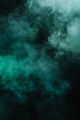 Fototapeta na wymiar a black wallpaper with a slight blue/green glow and mist 