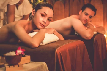 Gordijnen Caucasian couple customer enjoying relaxing anti-stress spa massage and pampering with beauty skin recreation leisure in warm candle lighting ambient salon spa at luxury resort or hotel. Quiescent © Summit Art Creations