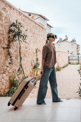 Travel,woman packing luggage in suitcase and travel in VR glasses nature,virtual reality exercise,...