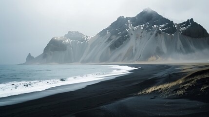 Mountains, water and black sand in Iceland