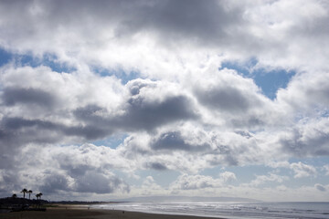 Storm clouds over the beach and ocean on a California winter day