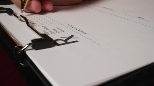 11 hispanic male filling out writing rx doctor prescription form