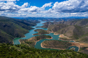 Abstract landscape of Sabor lake, Tras os Montes and Alto Douro, Portugal. Drone vision, aerial view of Serpente do Medal, Sabor River, tourist attraction and travel destination in Northern Portugal.