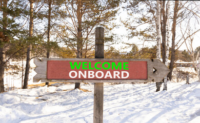 Welcome onboard symbol. Concept words Welcome onboard on beautiful wooden road sign. Beautiful forest snow blue sky background. Business, motivational welcome onboard concept. Copy space.