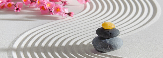 Fototapeta na wymiar Japanese zen garden with stone in textured sand
