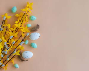 Composition of flowers and Easter eggs on a pastel background - 771691217