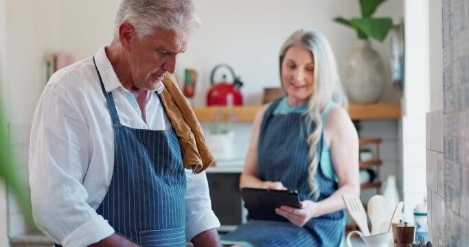 Old couple, cooking and tablet or online search in kitchen or planning for meal prepare, nutrition or dinner. Man, woman and internet recipe at stove or healthy lunch for retirement, bonding or food