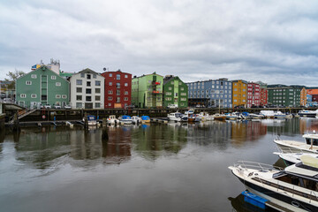 Wooden houses and boats in Trondheim - 771692216