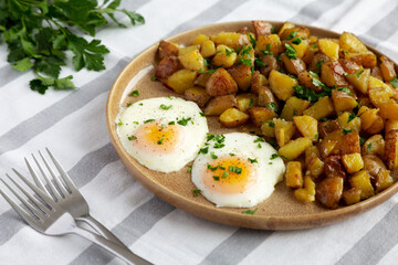 Homemade Garlic Herb Roasted Potatoes on a Plate, side view.