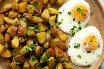 Homemade Garlic Herb Roasted Potatoes on a Plate, top view. Flat lay, overhead, from above. Close-up.