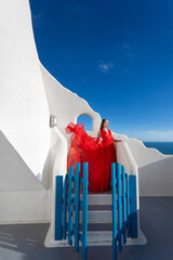 Woman Red Dress, Fashion Model In Long Silk Waving Gown Wings, Flying Fabric in Santorini