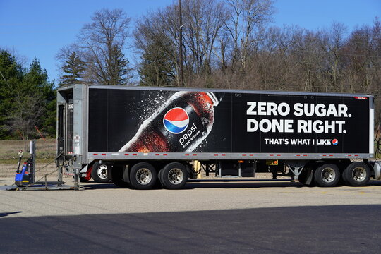 Pepsi distribution semi truck dropping off products with the Pepsi Zero logo on the trailer. 