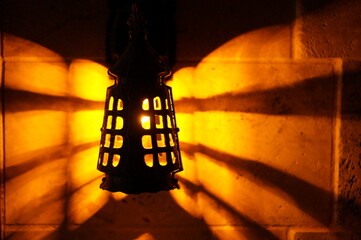 Light fixture on medieval  stone wall, Bokeh