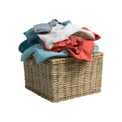 Pile of clothes in a square wicker basket cut out isolated on transparent background