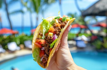 Close up of hand holding up an open taco against a tropical resort on a sunny day