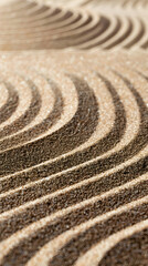 Fototapeta na wymiar Warm sunlight enhances deep shadows over the ripple-like sand patterns in this calming Zen garden image