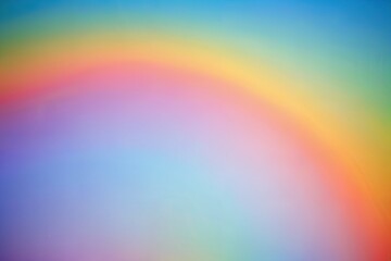 Rainbow pastel background with sunshine glare.
