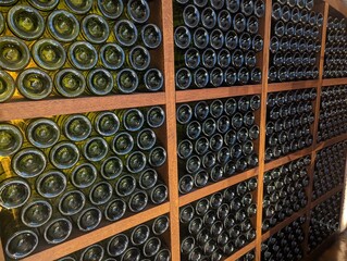 Wine racks, green bottles, wooden