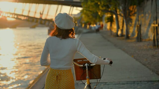Cyclist by the Seine at Sunset