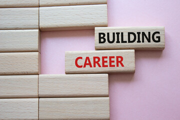 Building Career symbol. Wooden blocks with words Building Career. Beautiful pink background. Business and Building Career concept. Copy space.