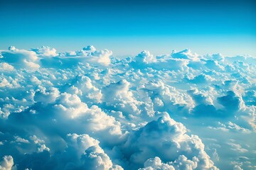 White clouds on blue sky background close up, cumulus clouds high in azure skies, beautiful aerial cloudscape view from above, sunny heaven landscape, bright cloudy sk.