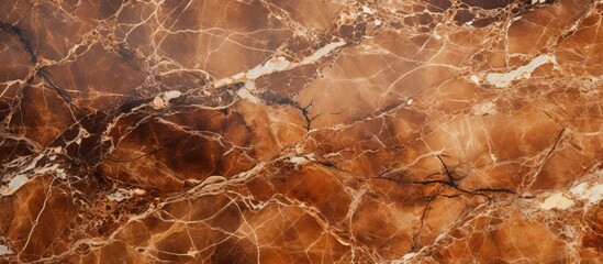 A close up of a beautiful brown marble texture resembling a landscape of amber hues, creating a mesmerizing pattern similar to wood grain or soil